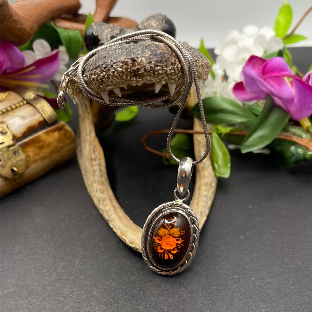 Carved Amber floral pendant and 925 finding A9